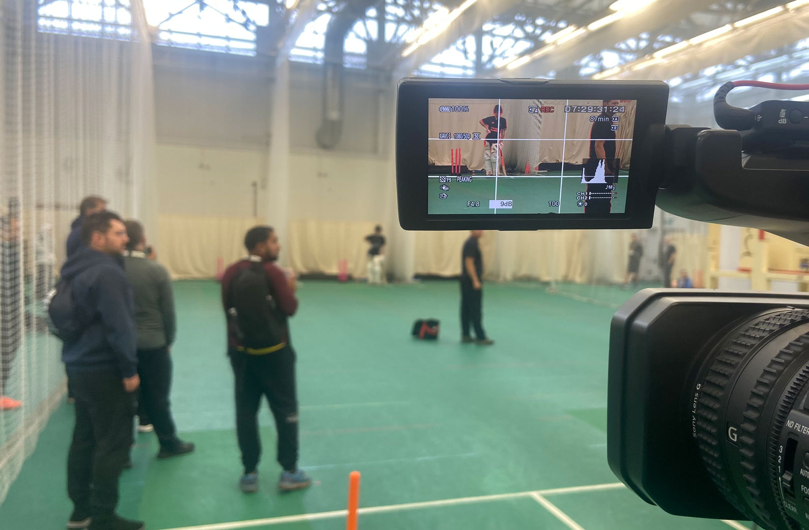 camera in view while filming a sporting event